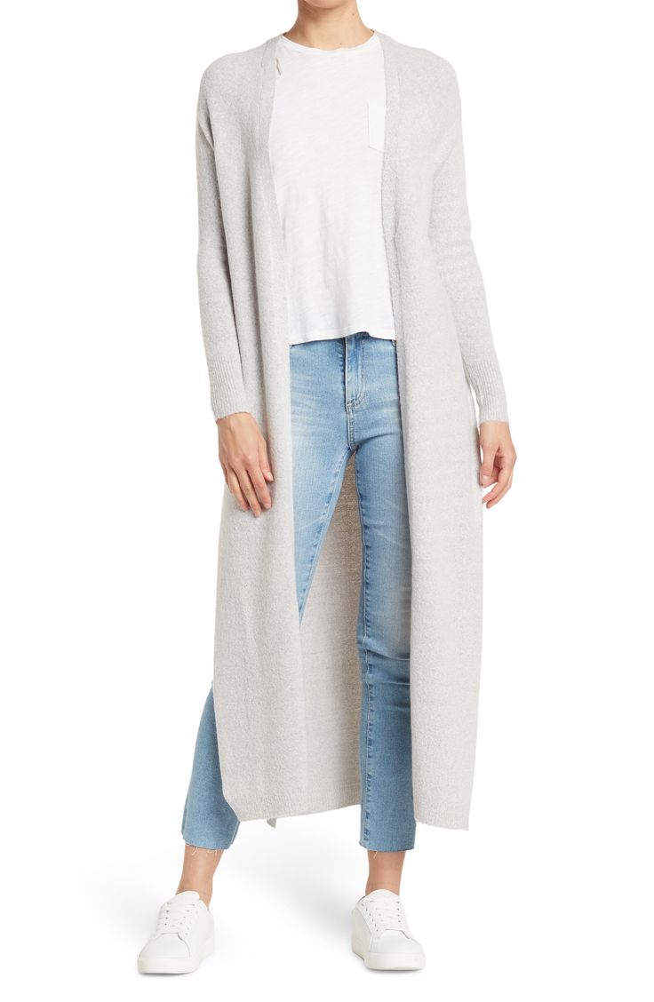 A knit duster jacket effortlessly layers over your look with it's longline fit. 49" length (size S) Open front Long sleeves Knit construction 75% acrylic, 22% nylon, 3% spandex Hand wash, dry flat Imported Model stats: 5'10" height, 32" bust, 25" waist, 36" hip. Model is wearing size S Long Knit Sweater Coat In Solid Color, Long Knit Sweater Coat For Fall, Full Length Fall Outerwear, Gray Long Soft Knit Outerwear, Long Gray Sweater Coat For Layering, Gray Long Sweater Coat For Layering, Versatile Long Winter Cardigan, Versatile Knit Outerwear With Relaxed Fit, Long Fall Cardigan For Layering