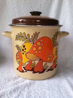 two ceramic pots with designs on them, one is brown and the other is yellow