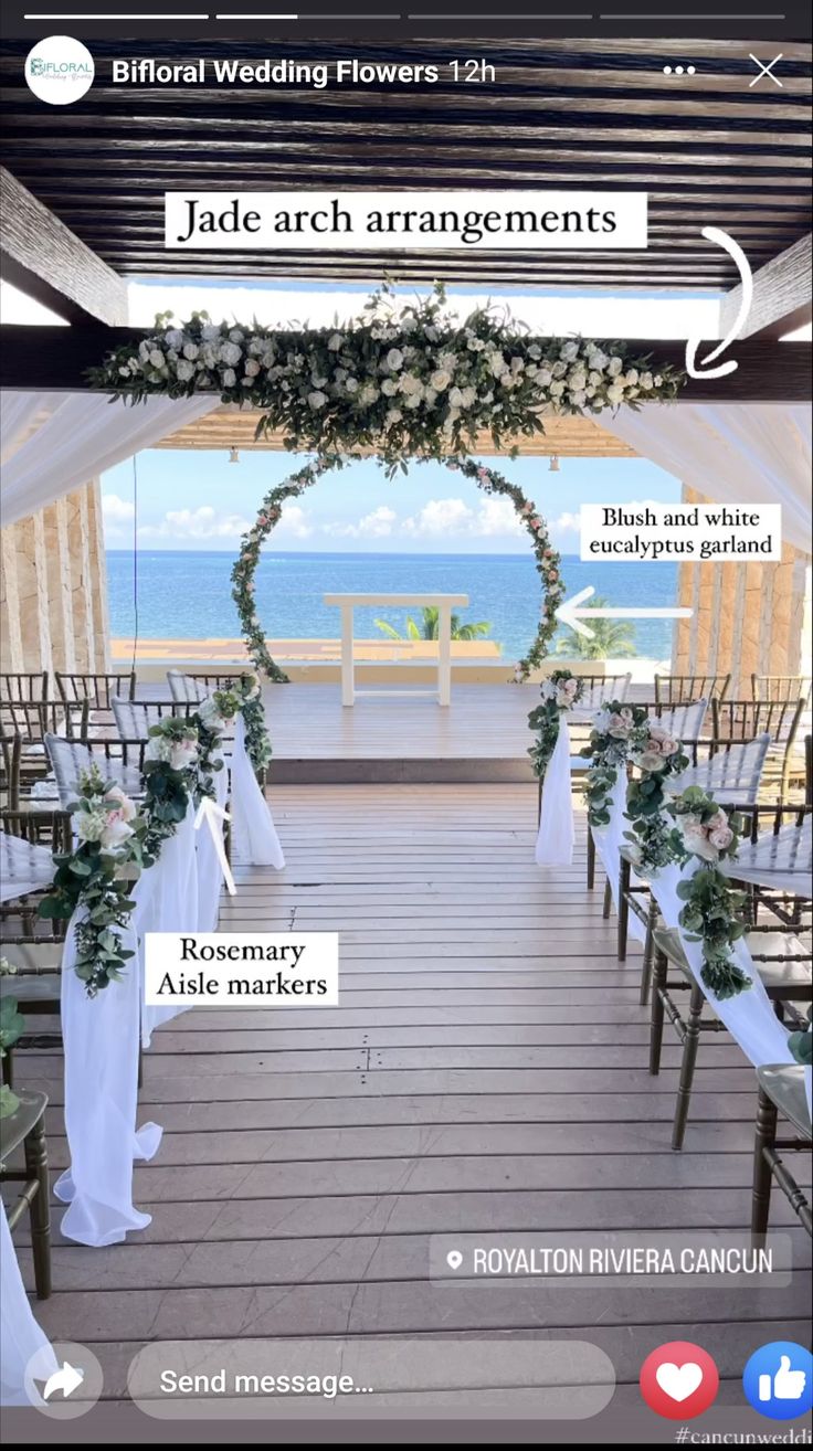 an image of a wedding venue with white flowers and greenery