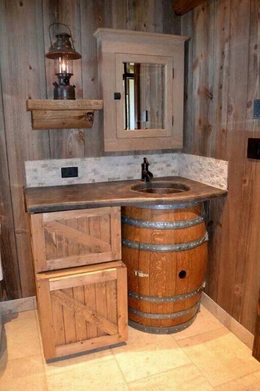 a bathroom with a sink and wooden barrel