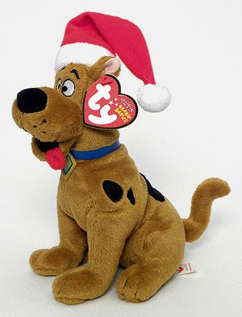 a stuffed dog with a santa hat on