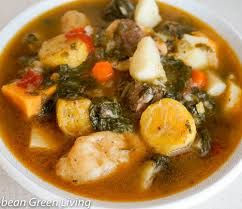 a white bowl filled with meat and vegetable soup