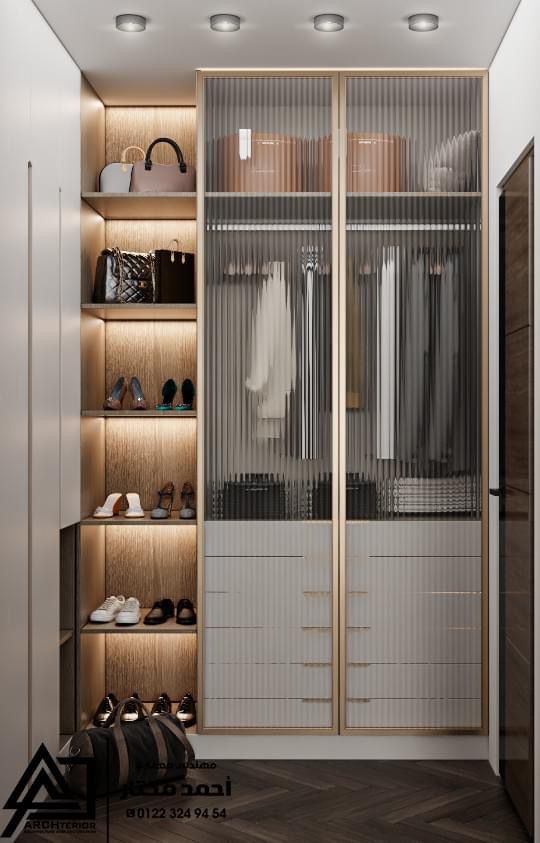 a walk in closet with wooden shelves and glass doors that are open to reveal shoes