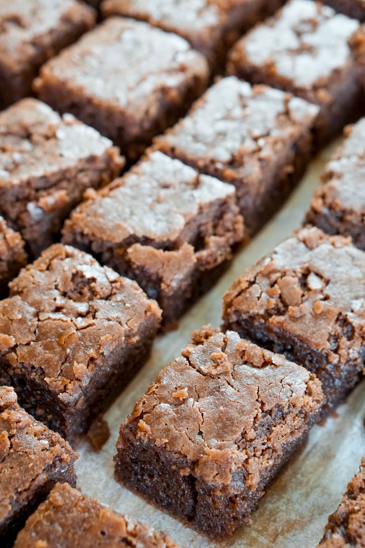 brownies cut into squares sitting on top of a table