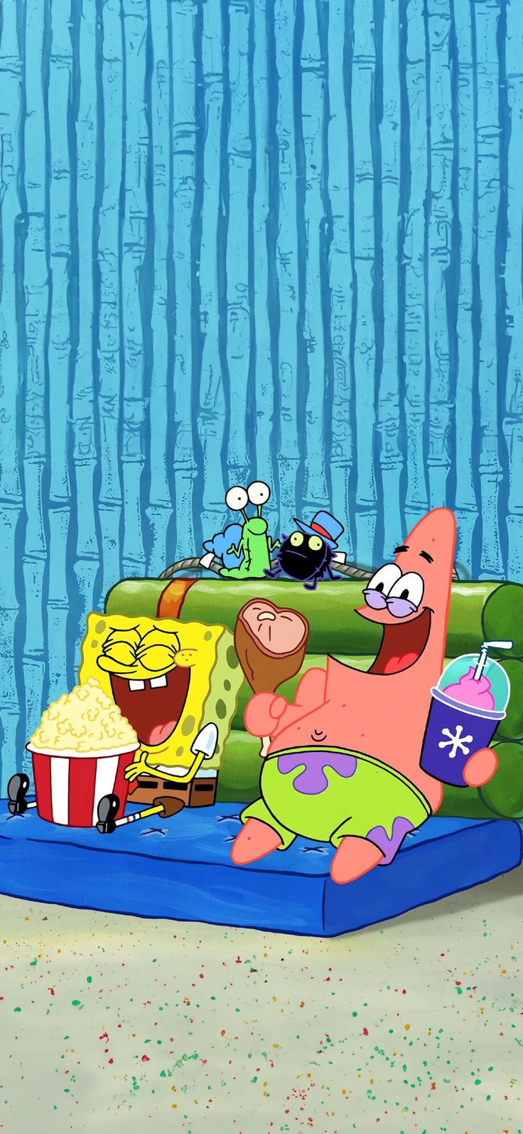 spongebob and friends are sitting on the couch with popcorn in front of them