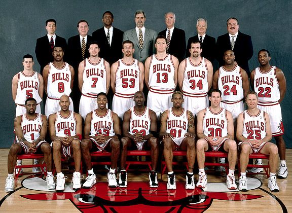 the men's basketball team is posing for a group photo in their uniforms and ties