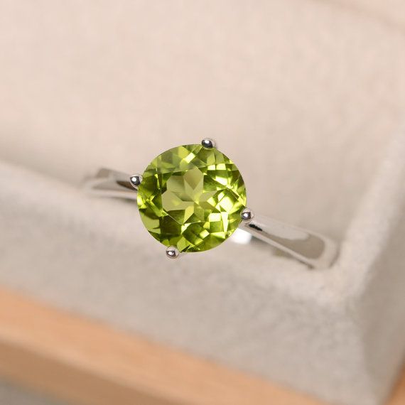 Peridot Rings With Brilliant Cut In Fine Jewelry Style, Fine Jewelry Peridot Rings With Brilliant Cut, Peridot Ring With Prong Setting In Round Cut, Green Sterling Silver Topaz Ring, Green Peridot Rings With Brilliant Cut, Peridot Birthstone Diamond Ring Fine Jewelry, Peridot Ring With Brilliant Cut, Classic Peridot Jewelry With Brilliant Cut, Green Topaz Sterling Silver Promise Ring