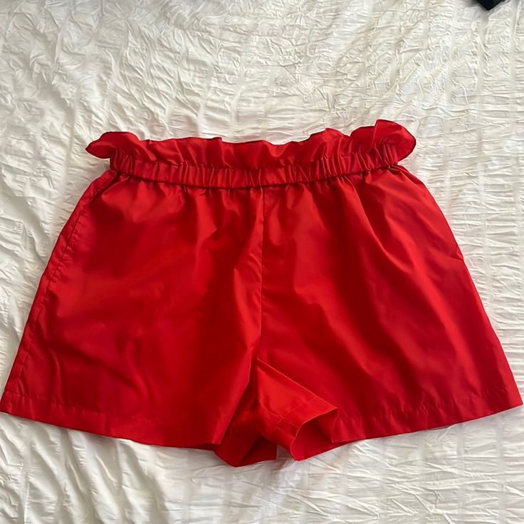 Lightweight Nylon Shorts (Unlined) With Side Pockets. Elastic Waist With Paperbag Style Ruffle. Love Them But I Prefer A Heavier Fabric. I Paid $56 Chic Nylon Short Bottoms, Chic Nylon Shorts, Chic Nylon Short Length Bottoms, Summer Nylon High Waist Bottoms, High Waist Nylon Summer Bottoms, High Waist Nylon Bottoms For Summer, Stretch Red Bottoms For Day Out, Summer High-waist Nylon Bottoms, Chic Red Beach Shorts