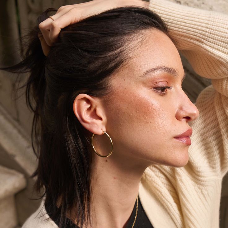 We combined a classic, pared-down aesthetic with 14k solid gold to create our timeless Tube Hoop Earrings. Made with forever in mind, these ultra-lightweight hoops are forged from solid gold (not plated or filled), which means they’ll never tarnish. Wear them all day, every day — they suit any situation. Minimalist Polished Finish Hoop Earrings For Everyday Luxury, Everyday Hammered Huggie Earrings, Timeless Round Hoop Earrings For Everyday Elegance, Minimalist Round Huggie Earrings, Timeless Everyday Elegance Hoop Earrings, Minimalist Everyday Elegance Huggie Earrings, Modern Sterling Silver Hoop Earrings For Everyday, Classic Hammered Hoop Earrings For Everyday, Classic Everyday Hammered Hoop Earrings