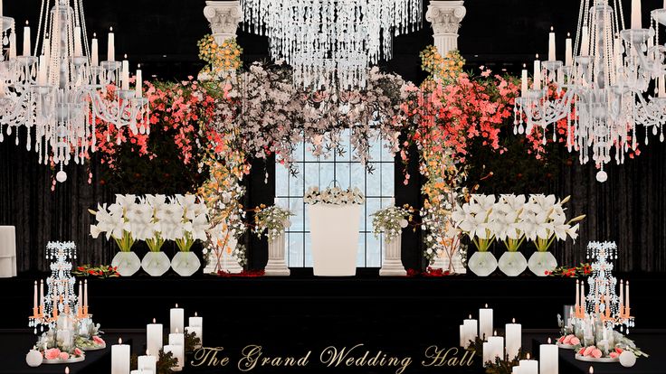 the grand wedding hall decorated with chandeliers and flowers