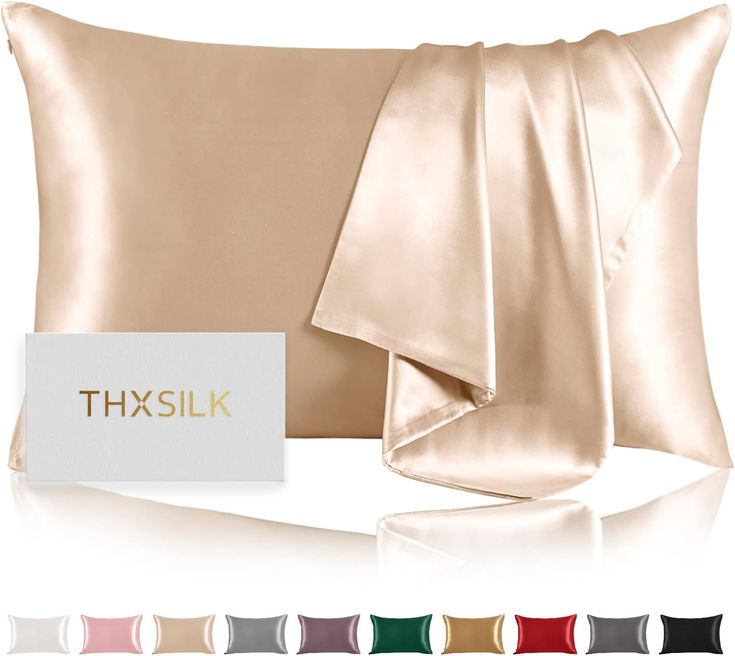 the silk pillow case is shown with satin sheets on it and two matching pillows in different colors