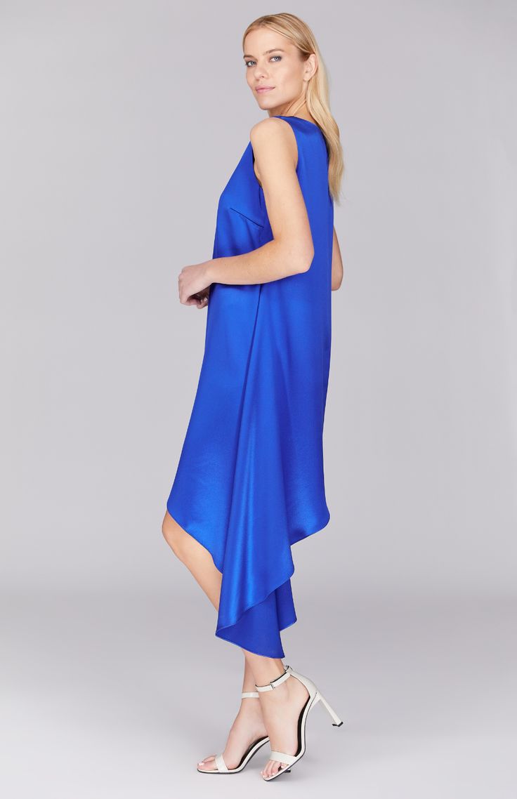 A sleeveless dress cut with a dramatically asymmetric hemline. Cut on the straight grain for a forgiving fit. This dress features a back neckline keyhole and is finished with a clean baby hem. Asymmetric Dress, Silk Crepe, Dress Cuts, Asymmetrical Dress, Steel Blue, Scarf Shawl, Skirt Pants, Jacket Tops, Electric Blue