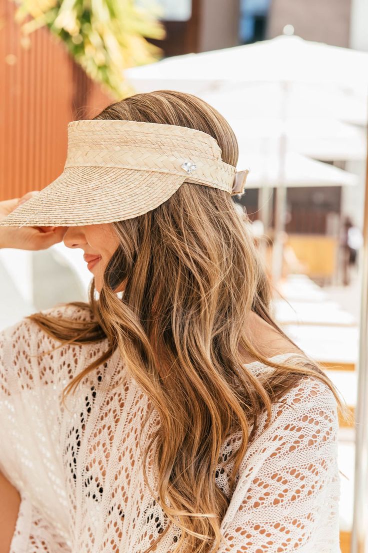 Handmade by artisans in Mexico, our new 100% baked palm leaf visor is perfect poolside or at the beach! Our Sunblock Straw Visor has a velcro closure and is adjustable. Our newest must-have accessory! Crystallized on the side of the visor. - Adjustable, inner sweatband Adjustable White Straw Hat For Poolside, Vacation Sun Visor With Uv Protection, Summer Visor For Sunbathing, Summer Sun Visor For Vacation, Lightweight Beach Visor, Summer Beach Sun Visor, Summer Straw Visor For Vacation, Adjustable Visor With Uv Protection For Beach Season, Adjustable Uv Protection Visor For Beach Season