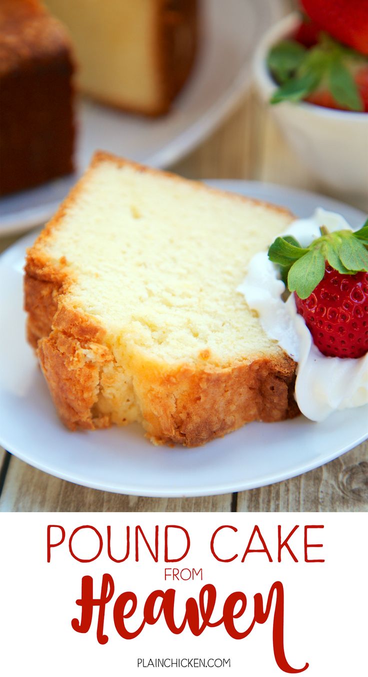 a piece of cake on a plate with whipped cream and strawberries in the background