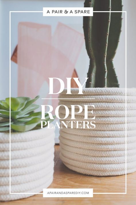 two rope planters sitting on top of a table next to a potted cactus