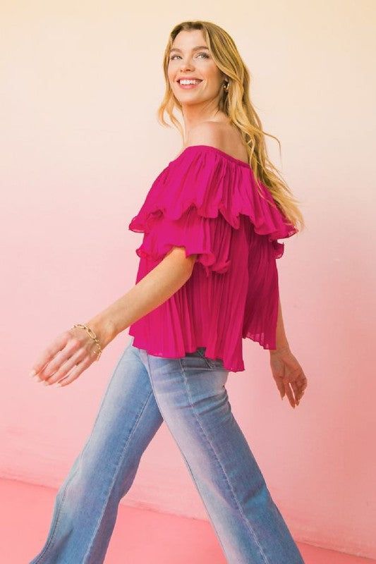 Fuchsia Pleated Top by Bella Chic Fashion Product Description: This cute top features a solid woven top featuring off shoulder neckline with ruffled flounce, fully pleated blouse with short sleeve Details Self: 100% Polyester Lining: 100% Polyester Size & Fit - Model is 5'8" And Wearing Size Small - Measurements Taken From Size Small - Approx. Length: 16" Pink Chiffon TopOff the Shoulder TopAccordion TopBaby Doll Top Pink Off-shoulder Top For Spring Party, Trendy Spring Off-shoulder Top With Ruffles, Feminine Off-shoulder Top With Ruffles For Summer, Trendy Ruffled Off-shoulder Top For Day Out, Trendy Off-shoulder Ruffle Top For Day Out, Trendy Off-shoulder Top With Ruffles For Day Out, Spring Off-shoulder Ruffle Top, Chic Ruffled Off-shoulder Top For Day Out, Summer Party Tops With Flutter Sleeves