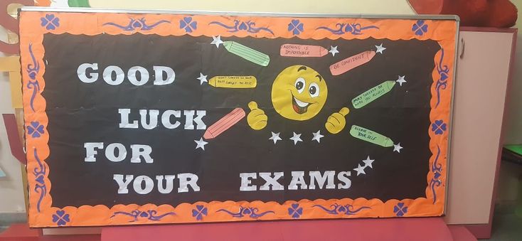 a sign that says good luck for your exam is on display in a school classroom