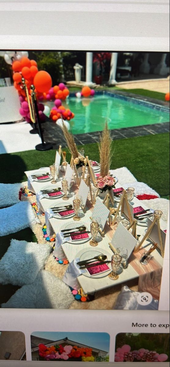 a table set up for a party by the pool