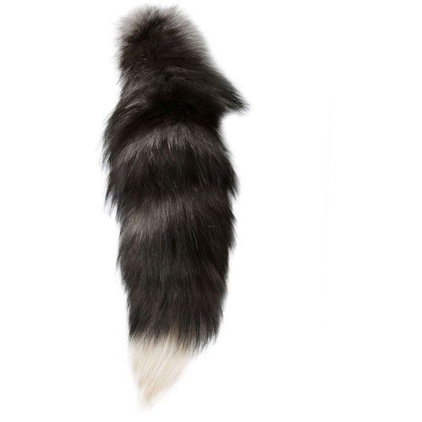 the tail of a black and white animal is shown on a white background in this image