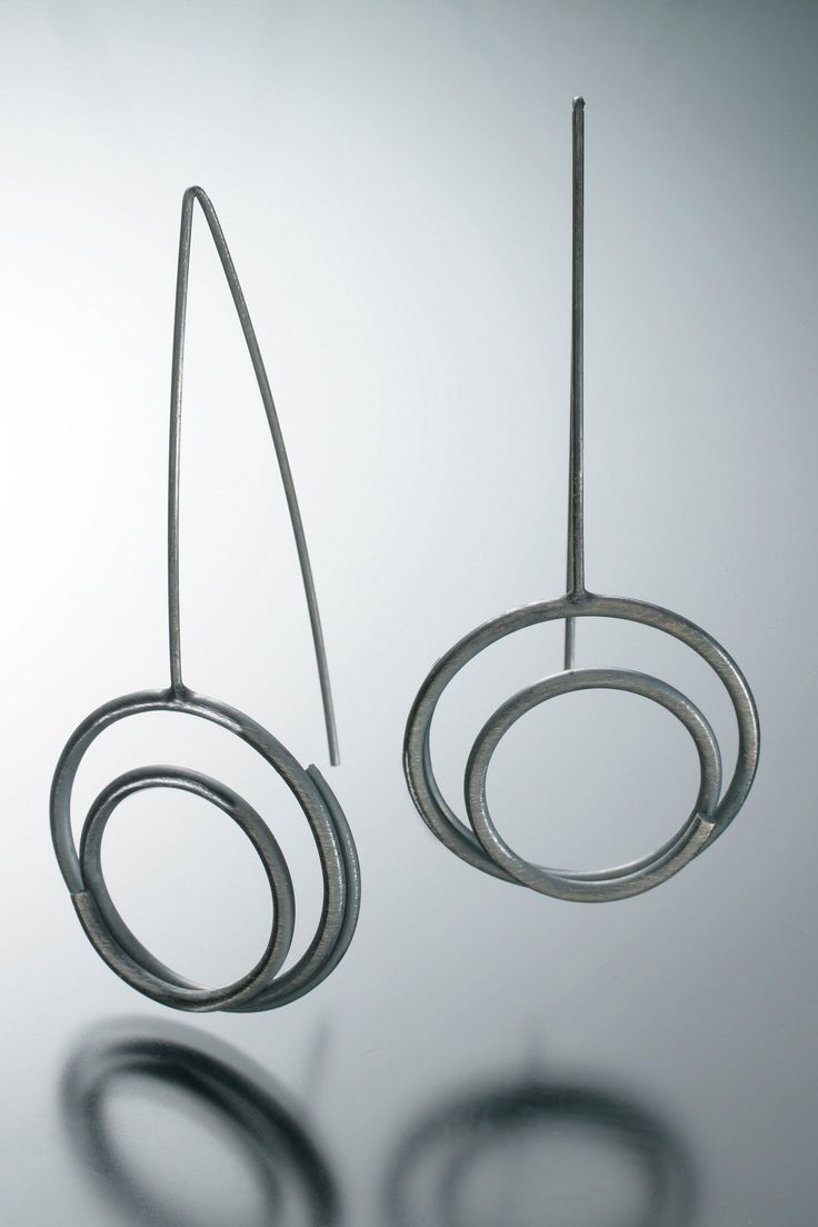 Hand-fabricated oxidized sterling silver circle in circle earrings. • Dimensions: 2" H x ¾" W Wire Exploration, Alexander Calder Jewelry, Green Lake Jewelry, Womens Jewelry Trends, Button Jewelry, Copper Rings, Unique Handmade Jewelry, Earring Sale, Contemporary Jewelry