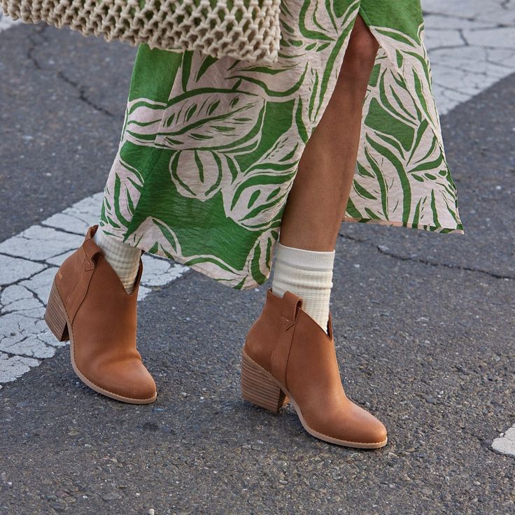 These ankle boots bring Western-inspired style to any look with a stacked leather-wrapped heel, pull-on straps, and versatile design. Dress them up with trousers and dresses, or opt for a more casual look by pairing them with your favorite jeans. Leather uppers. TOMS leather products support responsible manufacturing via the Leather Working Group. TPR outsole with TPU top lift. High-rebound comfort OrthoLite® Eco X40-Hybrid™ insole made with 32% eco content including 15% hybrid materials, 12% bi Spring Ankle Boots With Stacked Heel, Ankle Boots With Stacked Heel For Spring, Fall Ankle Boots With Stacked Heel, Casual Heeled Boots With Stacked Heel, Fall Moto Boots With Stacked Heel And Medium Width, Fall Pointed Toe Boots With Heel Strap, Casual Leather Boots With Sculpted Heel, Casual Fall Boots With Sculpted Heel, Casual Boots With Stacked Low Heel