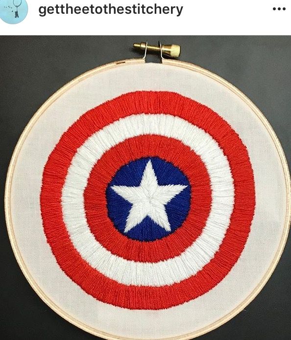 the captain's shield is on display in this embroidery pattern, which has been stitched into a hoop