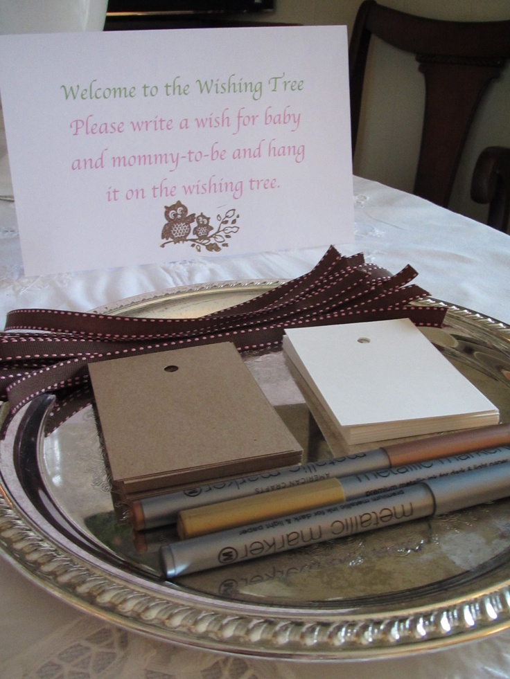 a plate with some books on it and a sign that says welcome to the wishing fire