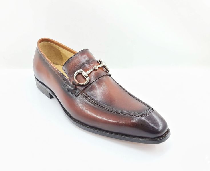 Style: 478-505-Whiskey Elegant Burnished Calfskin slip-on Loafer from the Carrucci collection features soft Calfskin lining, Patina Finish Horsebit Hardware detailing, and a clean welt! Elegant Brown Monk Strap Slip-on Shoes, Elegant Brown Moc Toe Moccasins, Elegant Brown Moccasins With Moc Toe, Elegant Brown Slip-on Monk Strap Shoes, Elegant Brown Moc Toe Slip-ons, Elegant Cognac Slip-on Moccasins, Elegant Cognac Moccasins With Round Toe, Elegant Cognac Moccasins With Leather Sole, Elegant Brown Moccasins With Brogue Detailing