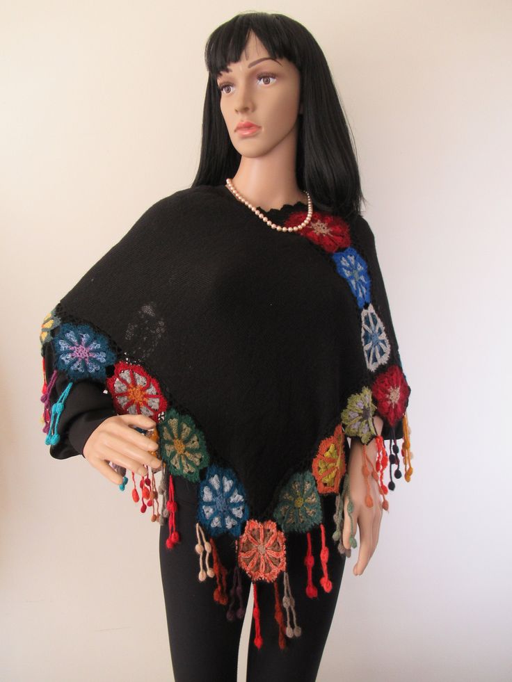 Beautiful and Unique Poncho with 100% Baby Alpaca This black gorgeous poncho is handknitted with a very thing thread of 100% baby alpaca that was naturally dyed with plants in the Altiplano of Peru, handmade by women from Pisac in the Andes of Peru. Alpaca wool is one of the most resistant and soft fibers in the world, it does not cause allergies, it is lightweight and so comfortable that its special for hand knitting. Alpaca wool is naturally breathable. We believe in the properties of natural Bohemian Alpaca Shawl One Size, Bohemian Alpaca Shawl For Winter, Multicolor Bohemian Wool Poncho, Black Bohemian Poncho One Size, Bohemian Alpaca Hand Knitted Shawl, Bohemian Alpaca Shawl, Bohemian Black Handwoven Poncho, Black Bohemian Handwoven Poncho, Handmade Alpaca Bohemian Poncho