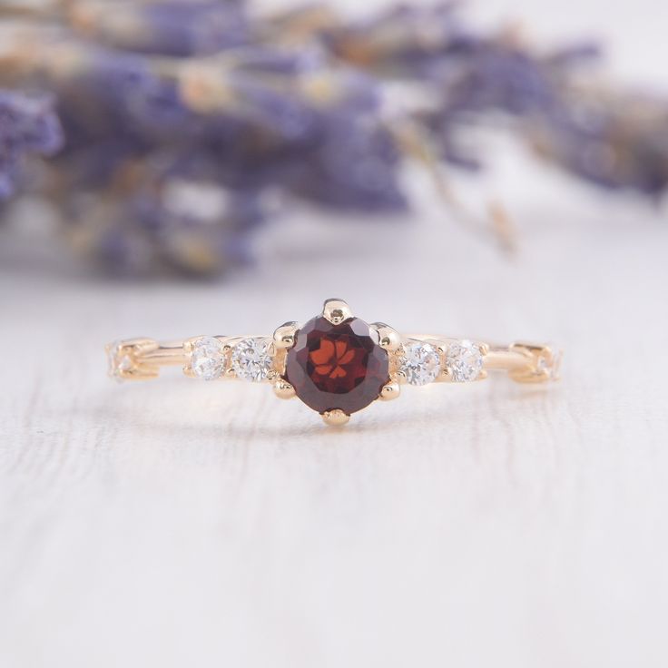 Simple & dainty 14k rose gold garnet engagement ring, Small tiny womens engagement ring,Garnet promise ring for her,Gold womens promise ring WE OFFER UNLIMITED PERIOD INSTALLMENTS PLAN This is a beautiful, stunning, feminine ring that works well for all occasions, styles, and ages. You will love it! Ring information: Main stone: Garnet Approximate size: 4.0mm Accent stones: Cubic zirconia Approximate size: 1.75mm (6 stones) Metal type: Gold Metal stamp: 14k Gold Installment Payments We offer Garnet Diamond Promise Ring In Yellow Gold, Garnet Diamond Ring With Prong Setting For Promise, Yellow Gold Garnet Diamond Promise Ring, Elegant 14k Rose Gold Ruby Promise Ring, Dainty Ruby Ring With Prong Setting, Dainty Round Cut Ruby Ring, Dainty Garnet Jewelry For Anniversary, Dainty Garnet Birthstone Ring, Small Engagement Rings