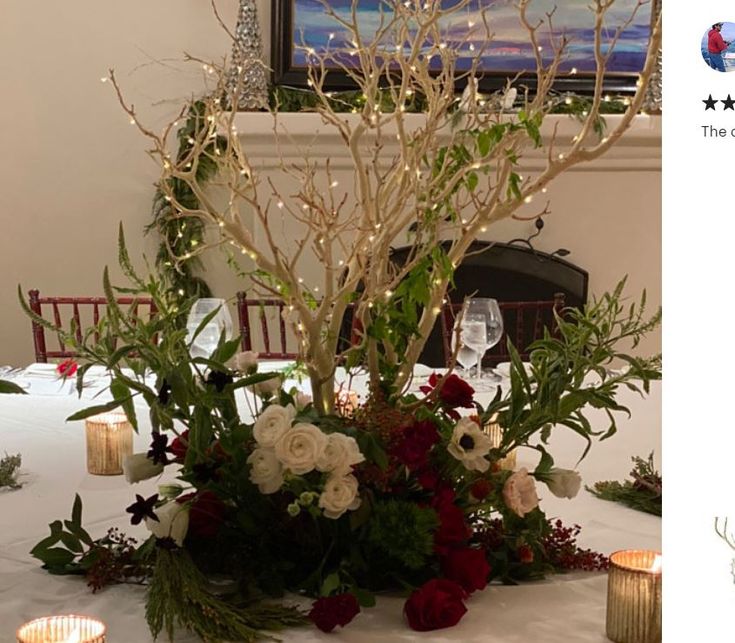 the table is set up with candles and flowers for an elegant centerpieces display