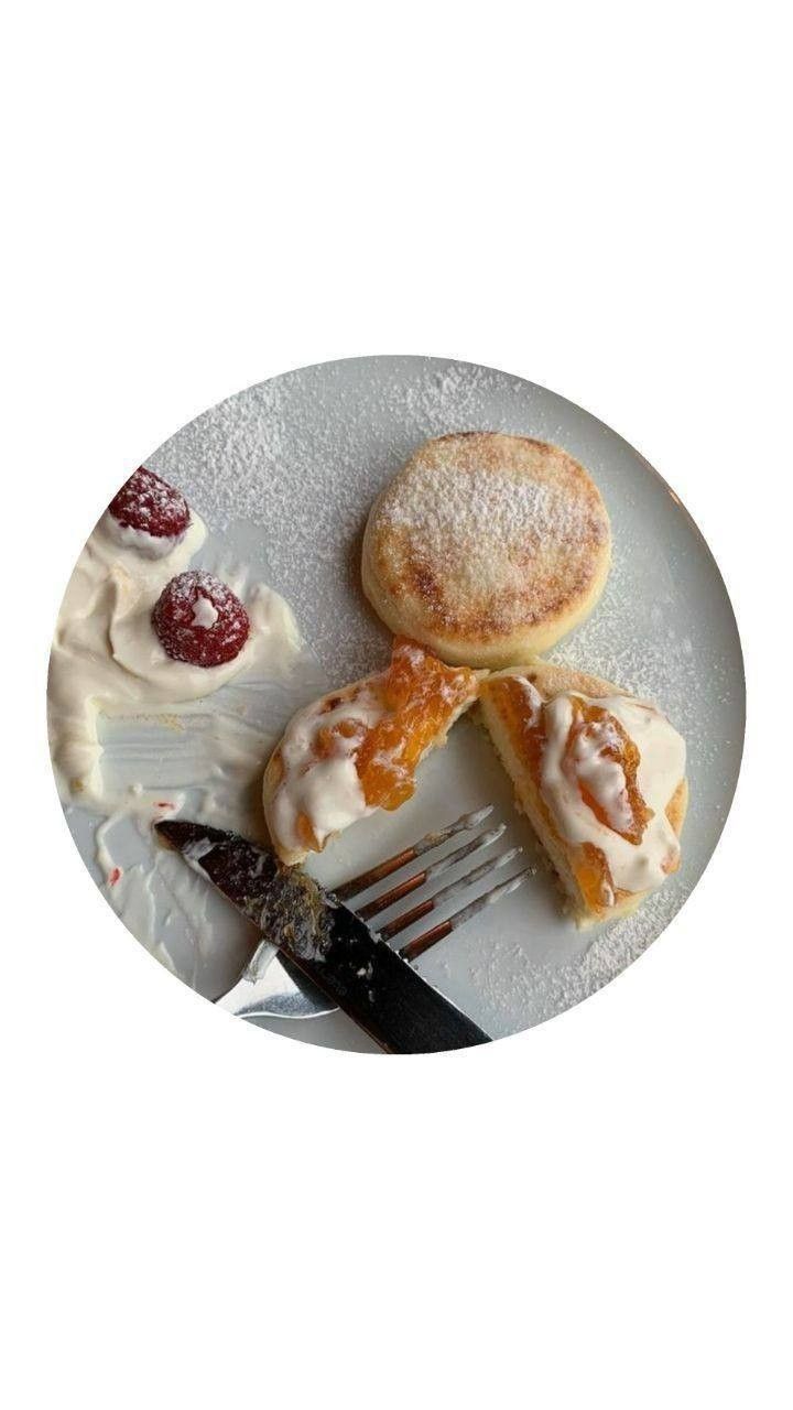 a white plate topped with three pastries and a fork