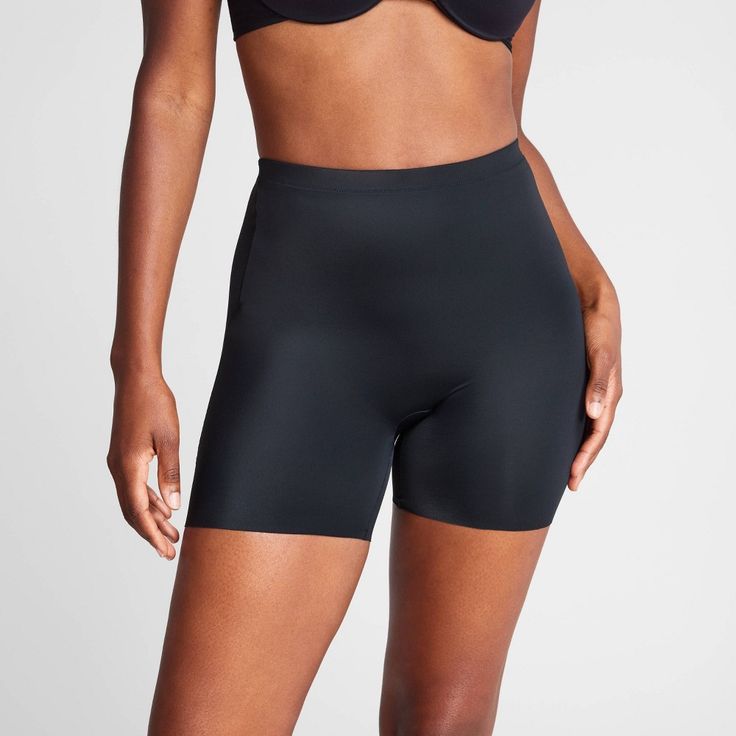 A breathable shaping short that offers strong support with zero fuss and discomfort. Designed to target your core with comfortable compression and a soft, plush waistband. Plus, the shorter inseam ensures it stays invisible under any hemline. Compression Seamless Full Coverage Shorts, Supportive Seamless Shorts, Compression Workout Shorts With Smoothing Effect, Solid Compressive Full Coverage Shorts, Compression Workout Shorts With Smoothing, Workout Compression Shorts With Smoothing Effect, Workout Compression Smoothing Shorts, Sports Shapewear With Stretch, Supportive Black Shorts