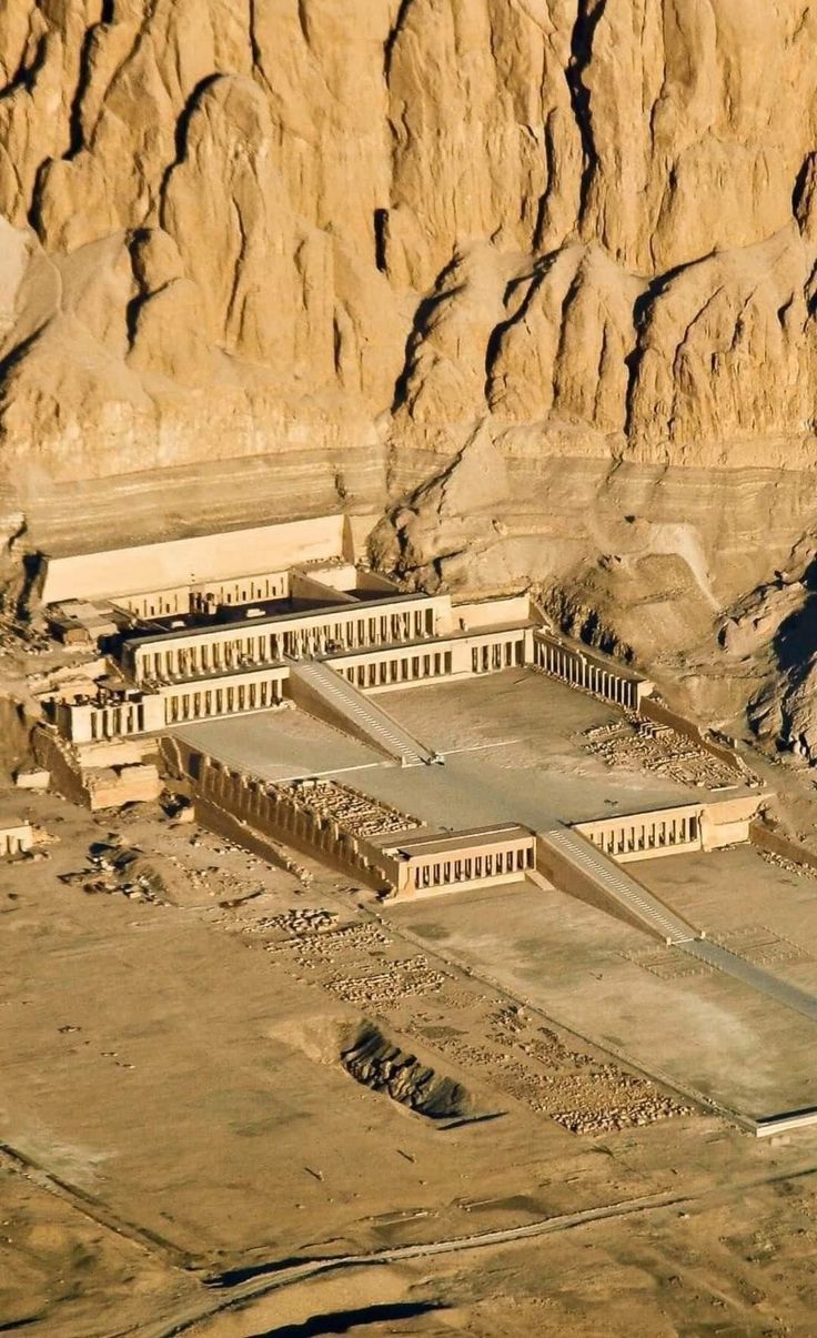 an aerial view of some buildings in the desert