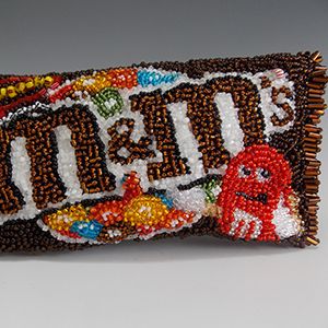 the beaded candy bar is decorated with an image of jelly beans and other candies