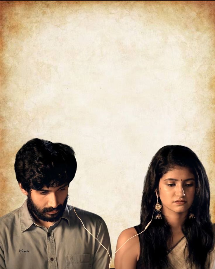 a man and woman sitting next to each other in front of a wall with an old paper background