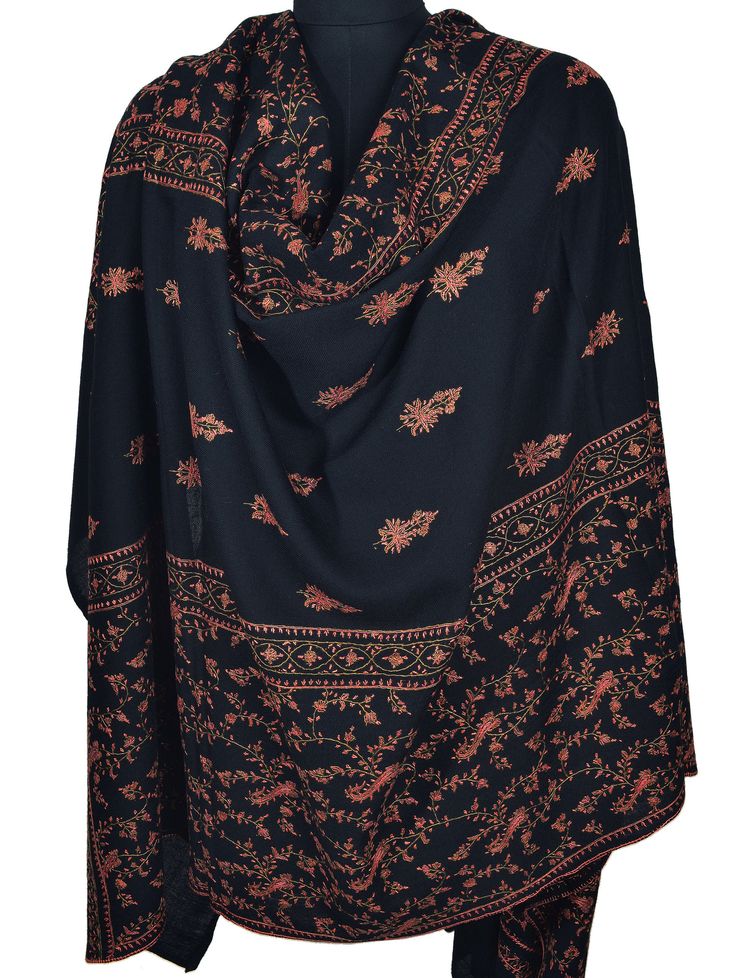 The deep jet-black color provides a striking backdrop for the elaborate Sozni needlework. Each motif is carefully stitched, with swirling teardrop shapes and delicate curls that make every one unique. The amount of detail in the embroidery speaks to the skill and artistry of the expert Kashmir artisan who made this shawl. Quality: Highest-Quality 100% Pure Pashmina Size: 40x80 inch or 100x200 cm Origin: Kashmir, INDIA.  Warm, Smooth, Super Soft, Symbol of Luxury This is our high grade Pashmina line. Retail Store Price: Over US$5000 Pashmina Kashmiri Embroidered Shawl or chain stitched shawls are a popular art of kashmir, crafted by skilled craftsman. Its a very rare contribution of art to the world by the people of Kashmir. These heirloom items are found in all corners of the earth, in ric Black Shawl For Eid With Traditional Drape, Black Pashmina Shawl With Intricate Embroidery, Black Pashmina Shawl With Resham Embroidery, Black Intricate Embroidery Pashmina Shawl, Black Embroidered Pashmina Shawl, Black Shawl With Intricate Embroidery In Traditional Drape, Black Shawl With Resham Embroidery In Traditional Drape, Traditional Black Shawl For Eid, Black Resham Embroidery Shawl Traditional Drape