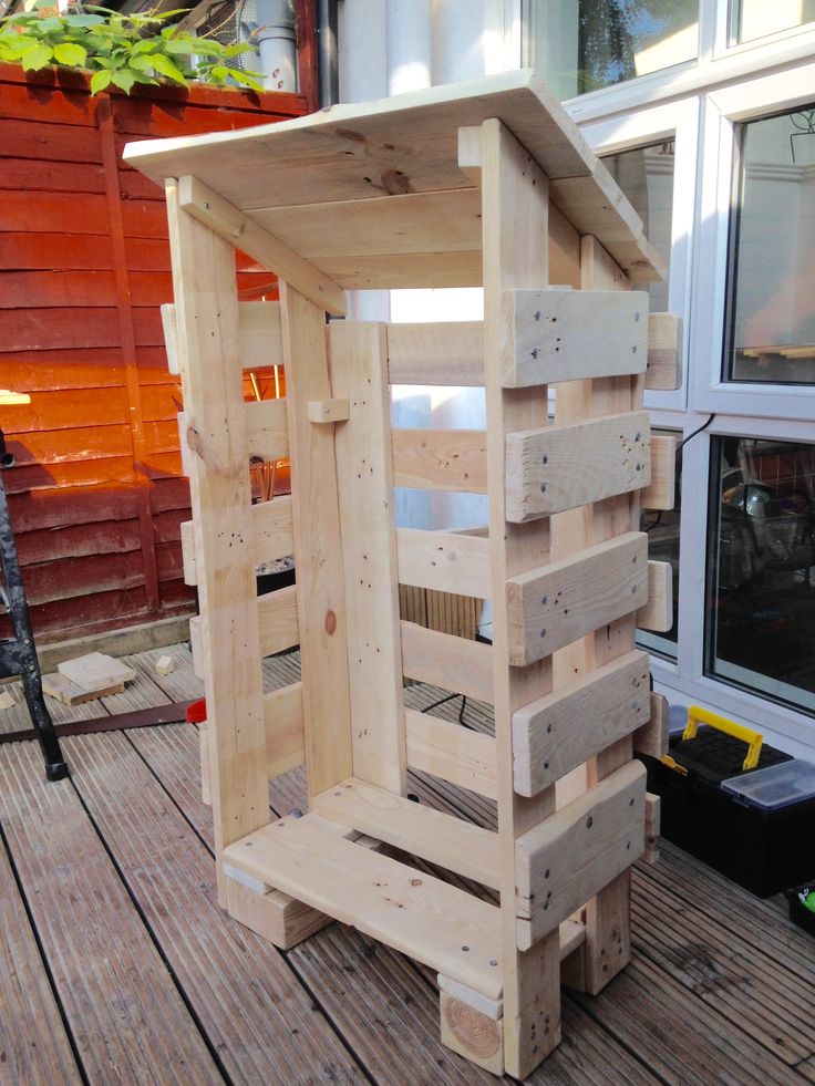 a wooden structure sitting on top of a wooden deck