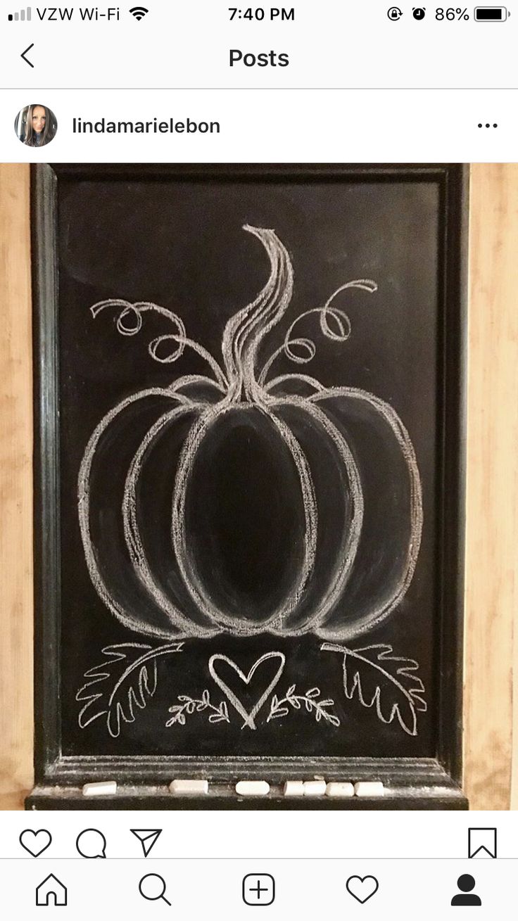 a chalkboard with a pumpkin drawn on it