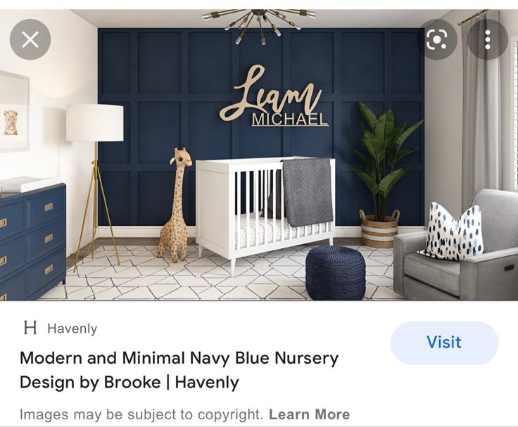 a baby's room with blue walls and white furniture, including a crib