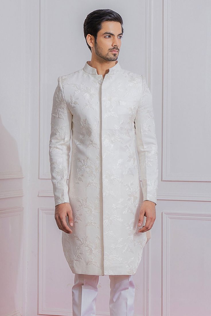 Off white achkan style sherwani with floral embroidery, patch pocket and full sleeves. 
Component: 1
Pattern: Embroidered
Type Of Work: Floral
Neckline: Mandarin
Sleeve Type: Full Sleeves
Fabric: Pure Georgette
Color: White
Other Details: 
Patch pocket
Floral motifs
Note: Pant and inner kurta worn by the model is not for sale
Occasion: Sangeet,Destination Wedding - Aza Fashions Indo Western For Men, Blouse Yoke, Indian Handicrafts, Sherwani For Men, White Kurta, Western Jacket, Bespoke Tailoring, Indian Fashion Designers, Indo Western