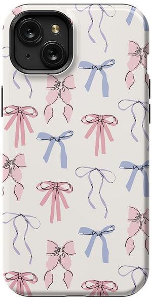 an iphone case with pink and blue bows on it, in front of a white background