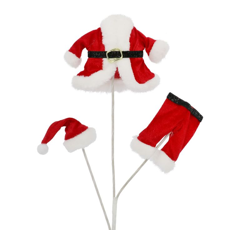 a santa clause hat and pants on top of a stick