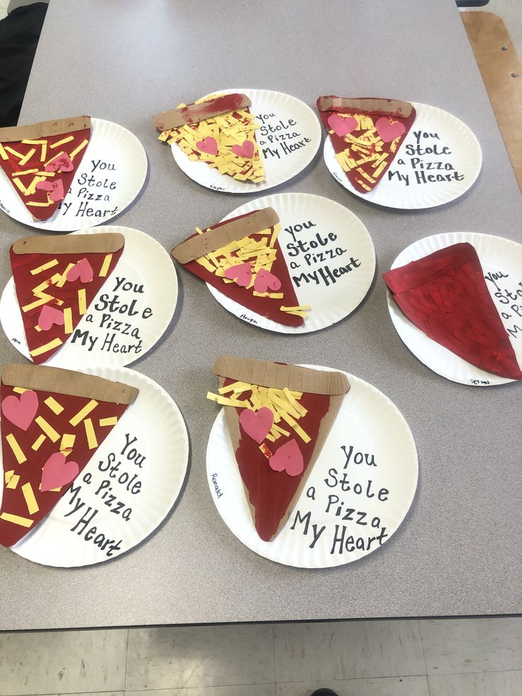 paper plates with slices of pizza on them that say, you stole my heart out