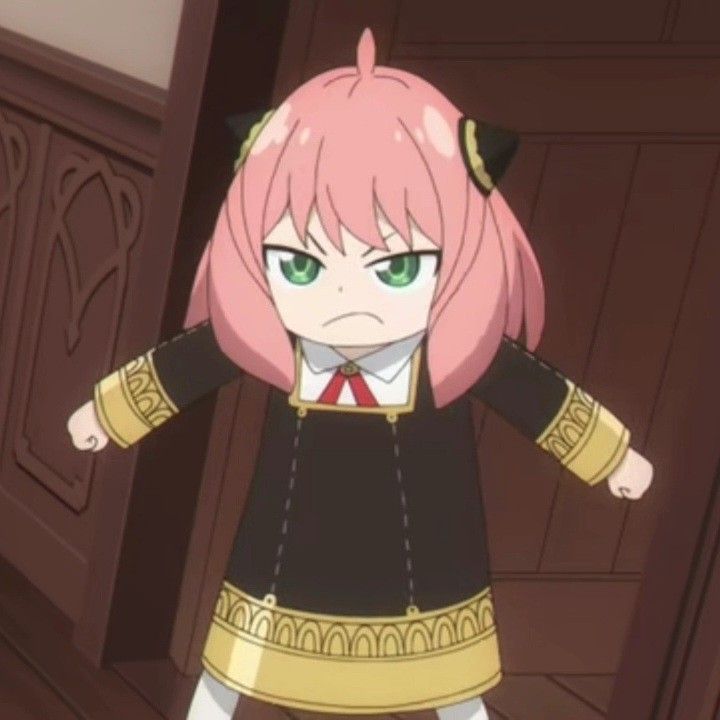 an anime character with pink hair and green eyes standing in front of a wooden door