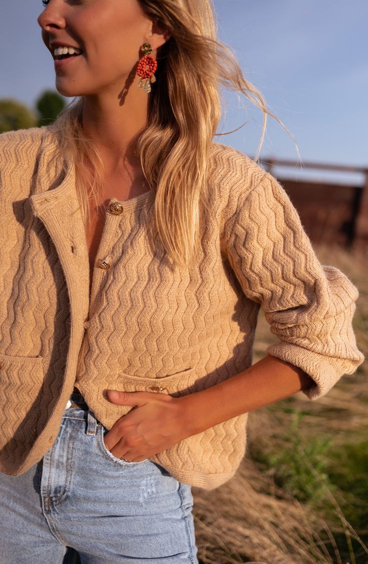 Camel colored, long sleeve cardigan that is super soft and cozy in addition to having pockets on the front as well as buttons. This is a dreamy cardigan to be worn all Fall and Winter long! Our model wears the Beige Lysou Dress, the Light Blue Hunter Jeans and the Brown Tressy Shorts ONE SIZE (fits from US 2-4-6) Length 19.29 in - Width 21.26 in Contexture: 10% wool - 20% polyamide - 30% polyester - 40% acrylic Washing: on delicate setting recommended Terracotta Outfit, Clothes Europe, Women's Fall Fashion, Parisian Women, Steel Earrings, Favorite Sweater, Natural Elements, Camel Color, Sleeve Cardigan