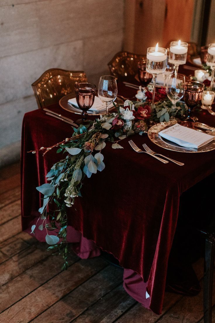 the table is set with candles and place settings