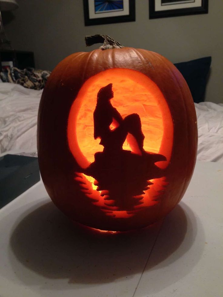 a carved pumpkin sitting on top of a table