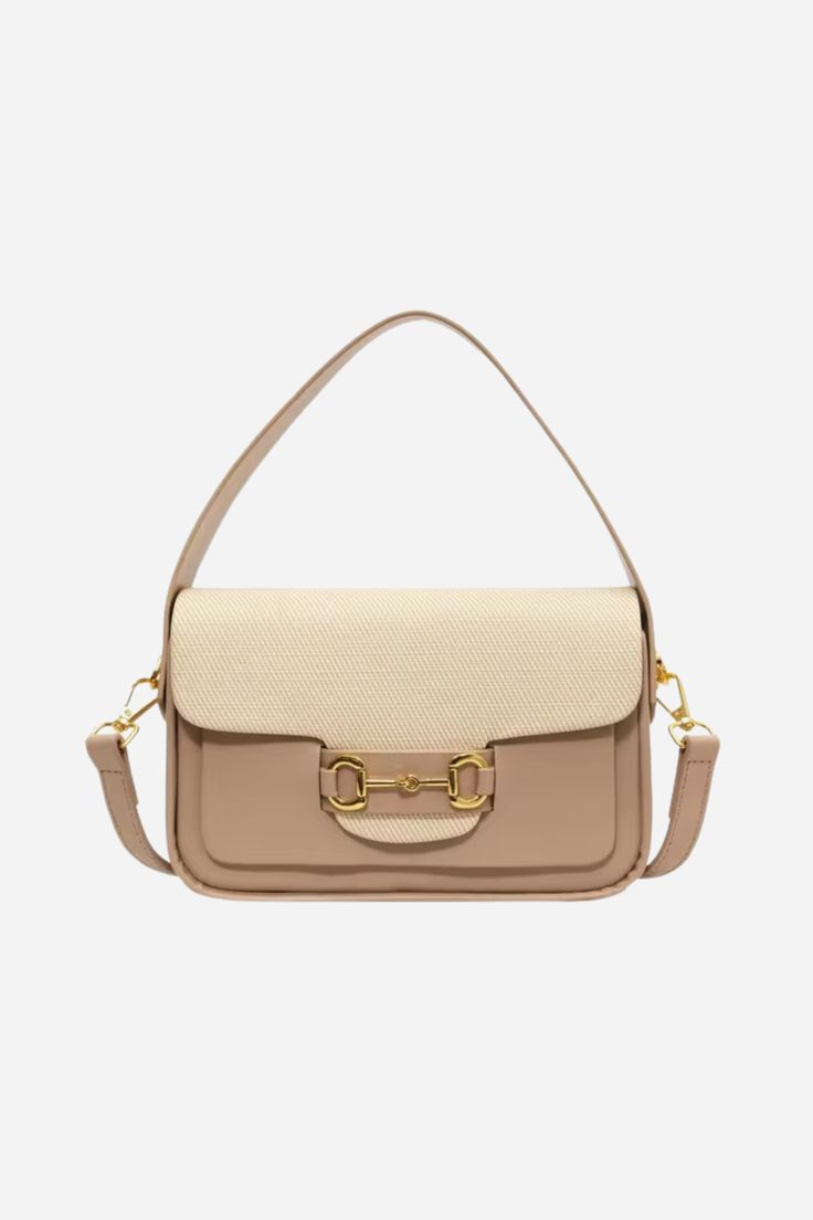 Introducing our Lexi Top Handle Bag - a perfect blend of style and functionality for the modern equestrian. Crafted from premium vegan leather in a warm & neutral palette, this versatile purse transitions effortlessly from a chic crossbody to a grab-on-the-go mini. Featuring an iconic horse bit detail in gold. The top flap opens from the back with a magnetic snap closure. Fully lined interior with substantial main compartment to hold all of your evening and everyday essentials. 8" L x 5" H x 3" Chic Saddle Bag With Gold-tone Hardware For Travel, Beige Flap Bag With Adjustable Strap For On-the-go, Beige Saddle Shoulder Bag With Detachable Strap, Cream Shoulder Bag With Gold-tone Hardware For Work, Trendy Saddle Bag With Gold-tone Hardware For Everyday, Elegant Beige Saddle Bag With Adjustable Strap, Luxury Everyday Beige Saddle Bag, Classic Beige Saddle Bag With Top Handle, Classic Beige Top Handle Saddle Bag