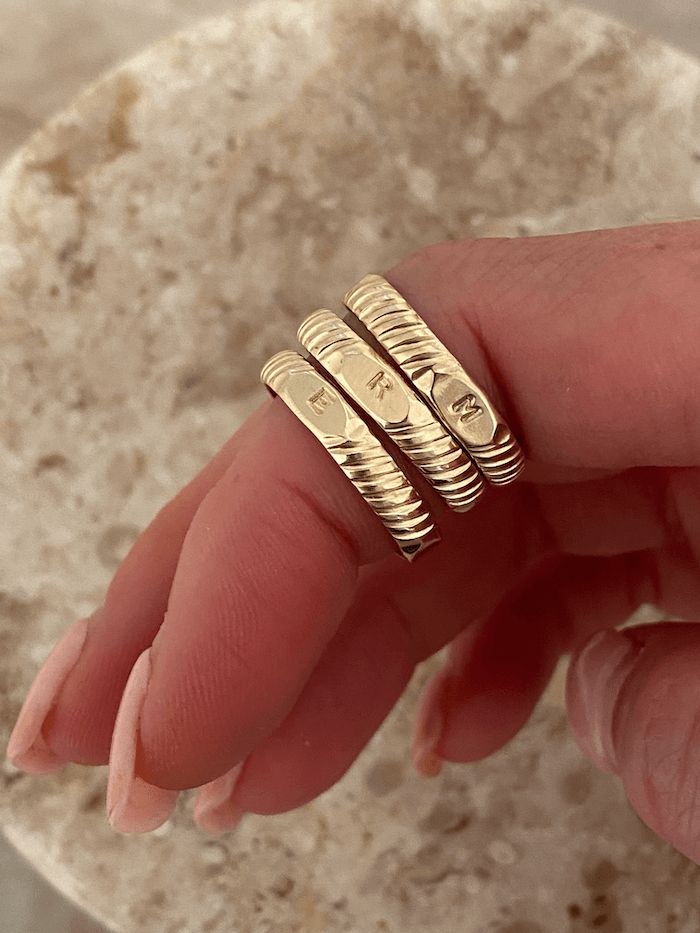 Our initial signet band is an everyday staple, personalized. The perfect way to showcase yourself or someone you love. Not to mention, they make the perfect custom gifts. Modeled with: 2 hammered stacking rings Adjustable Yellow Gold Initial Ring, Gold Stackable Rings With Initials For Everyday, Personalized 14k Gold Initial Ring For Promise, Everyday Gold Stackable Rings With Initials, Everyday Engraved Initials Open Ring, Gold Sterling Silver Initial Stackable Ring, Signet Ring Aesthetic, Gold Sterling Silver Stackable Initial Ring, 14k Gold Stackable Rings With Initials